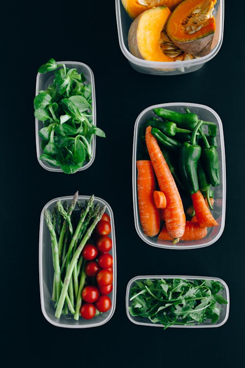 Fresh Vegetables on Plastic Containers