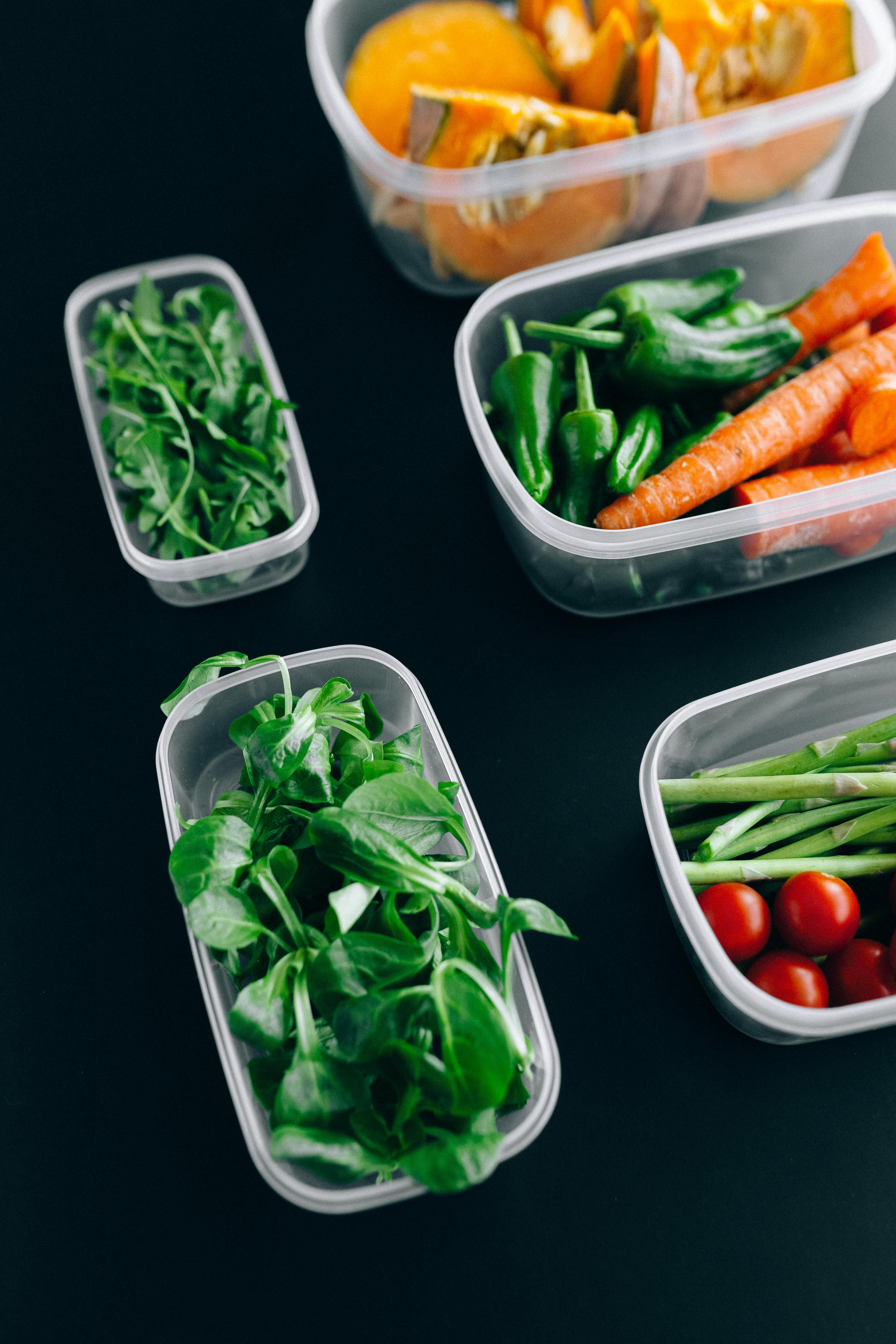 fresh vegetables in clear plastic container