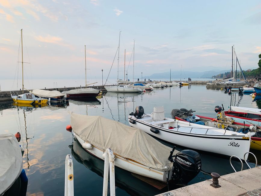 Stunning Full Day Amalfi Coast VIP Yacht Excursion from Rome by Train Review 2026 - Tranquil marina scene in Lazise, Veneto with boats and calm waters at sunset.