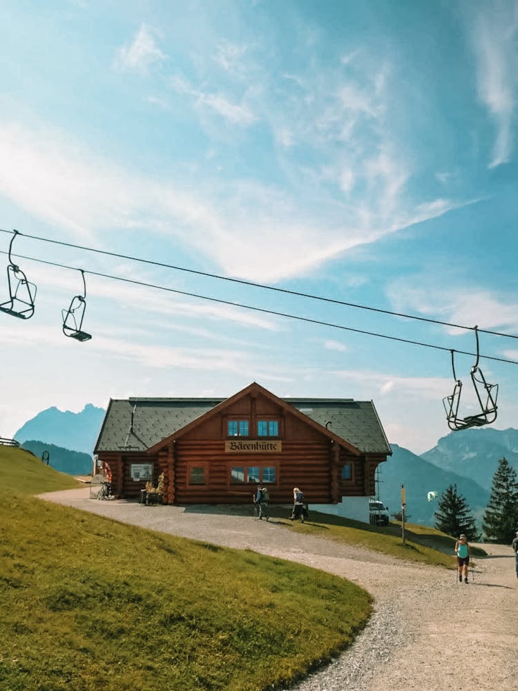 Chairlift Above Cabin In Mountains