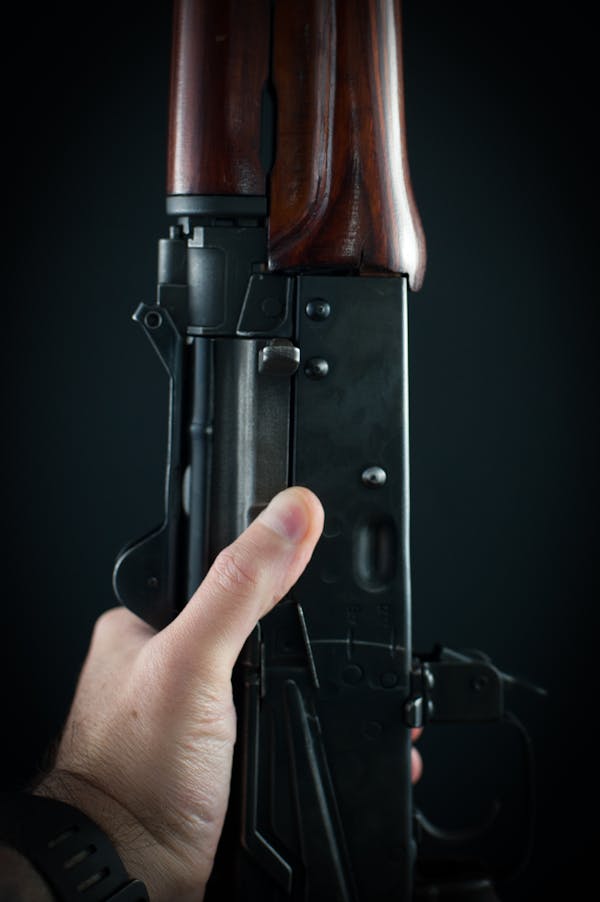 A Person Holding a Rifle