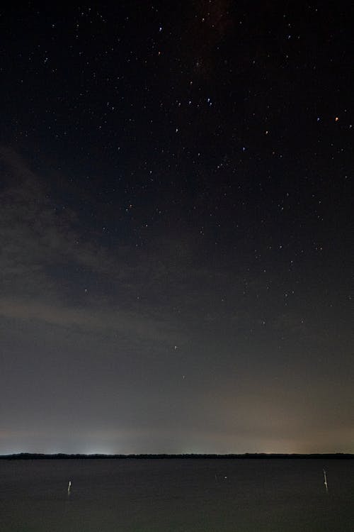 Landscape silhouette under dark sky at night