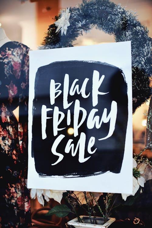 Free Black Friday Sale Poster on a Glass Panel Stock Photo