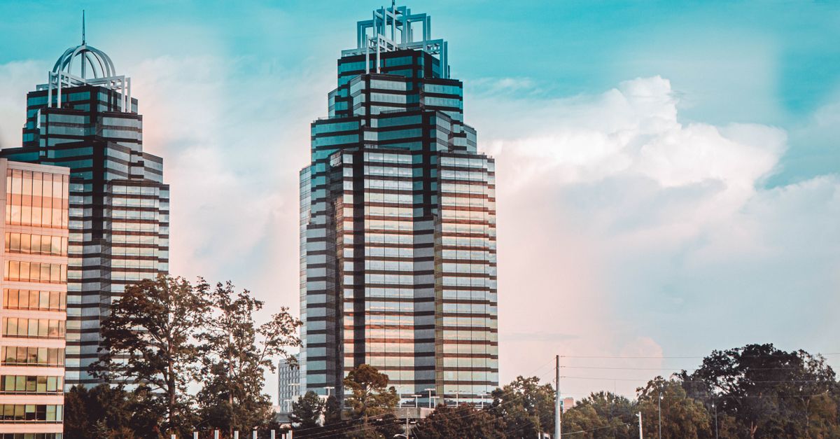 Striking view of Atlanta's iconic King and Queen Towers against a vibrant sky.