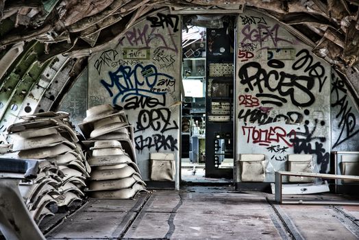 An Abandoned Plane with Vandalized Walls 