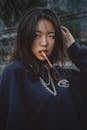 Girl in Sweatshirt with Cigarette