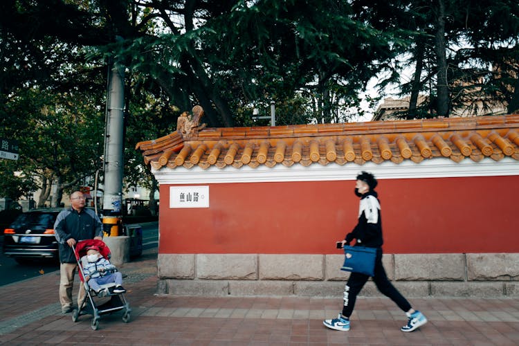 People Walking On Street In Japanese Town