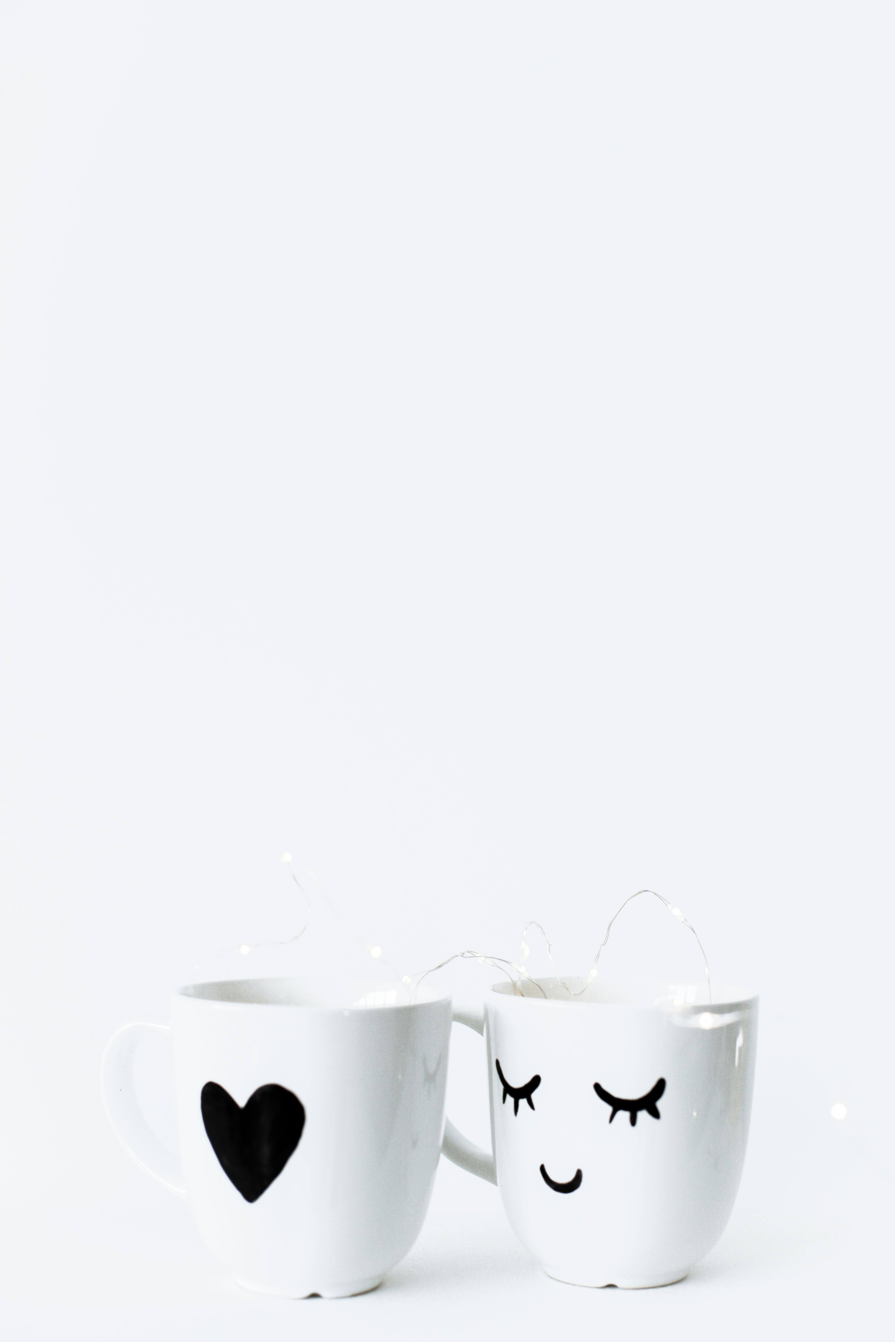 creative white mugs on white surface