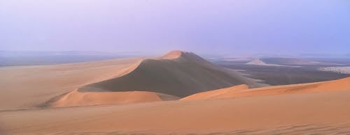 Great sand dunes in desert at sundown