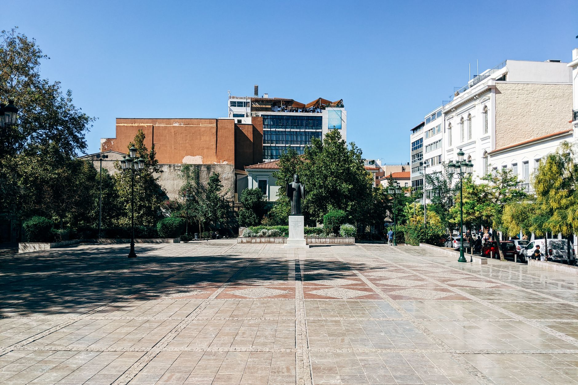 Stone buildings and pine slopes above the central square of Pano Platres
