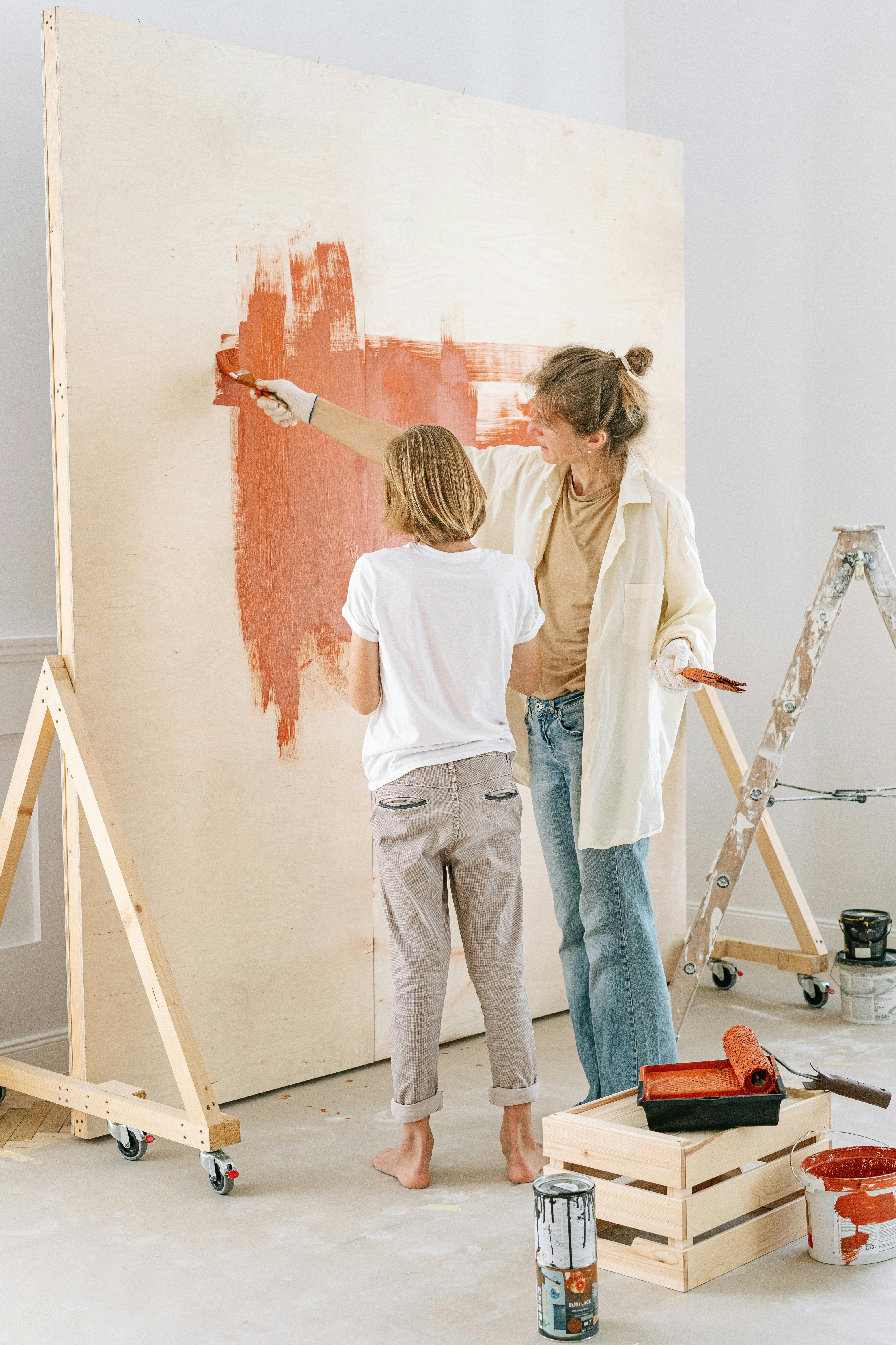 mother and son painting the wall