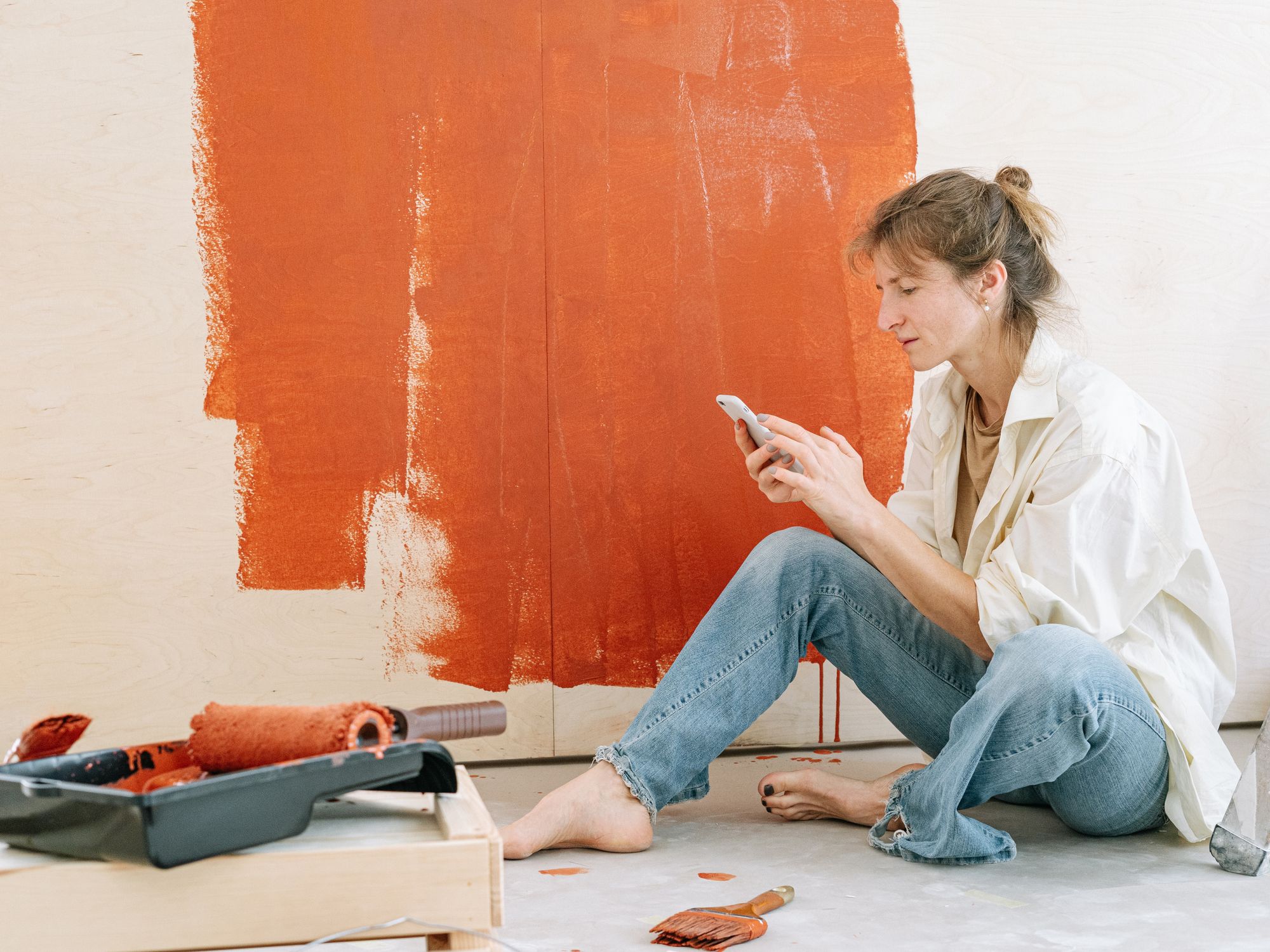 Painters & Decorators in Northwood, London — professional decorator painting a wall with a roller
