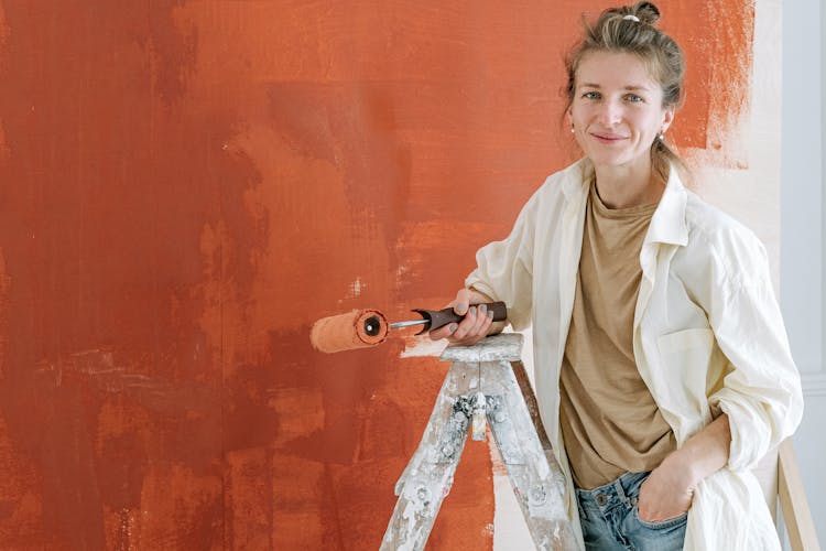 Woman Holding A Paint Roller 