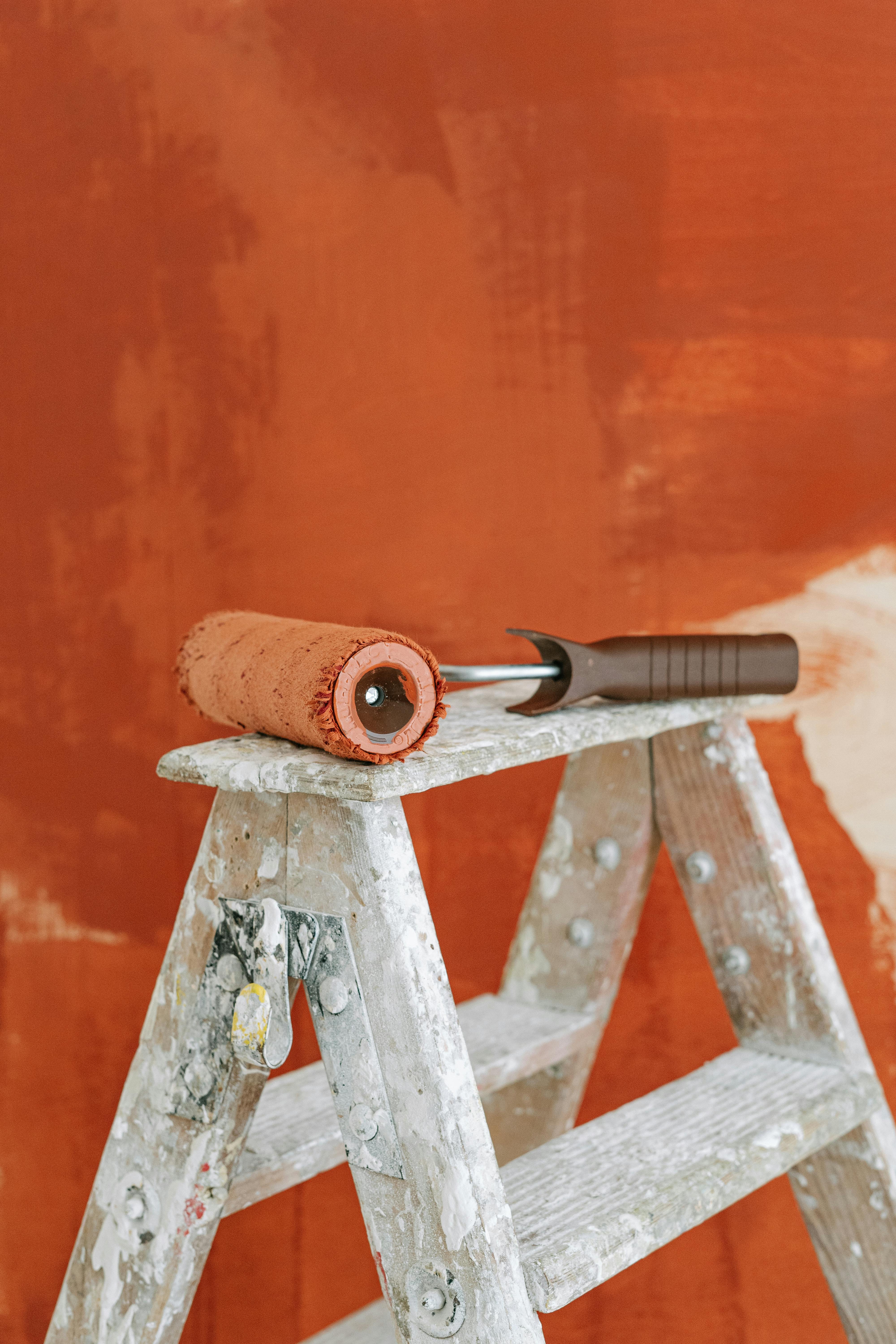 Painter Showing Paint Rollers Stock Photo - Download Image Now