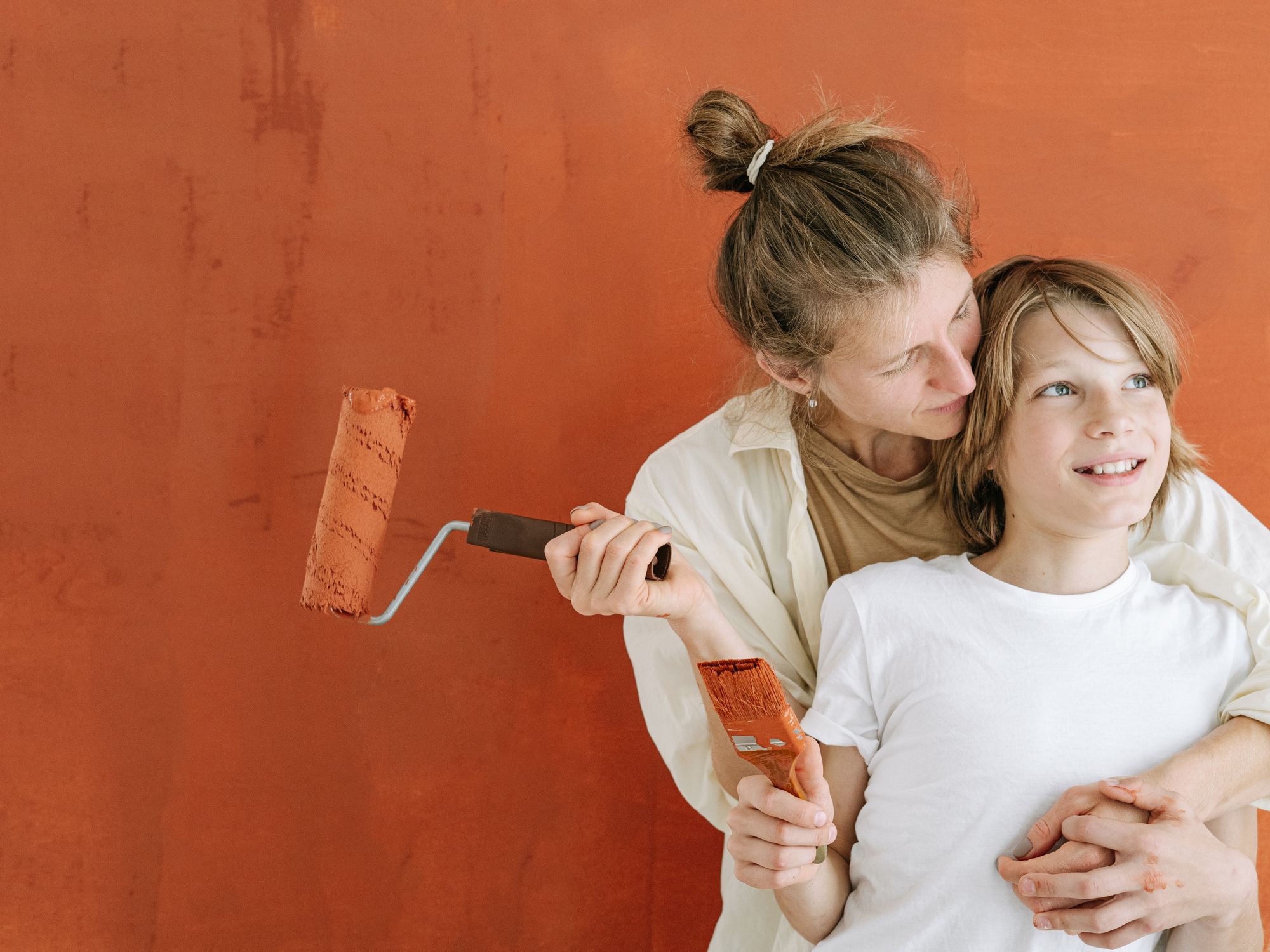 Exterior Painting in Haggerston, Hackney — painter refreshing a house exterior in weatherproof paint