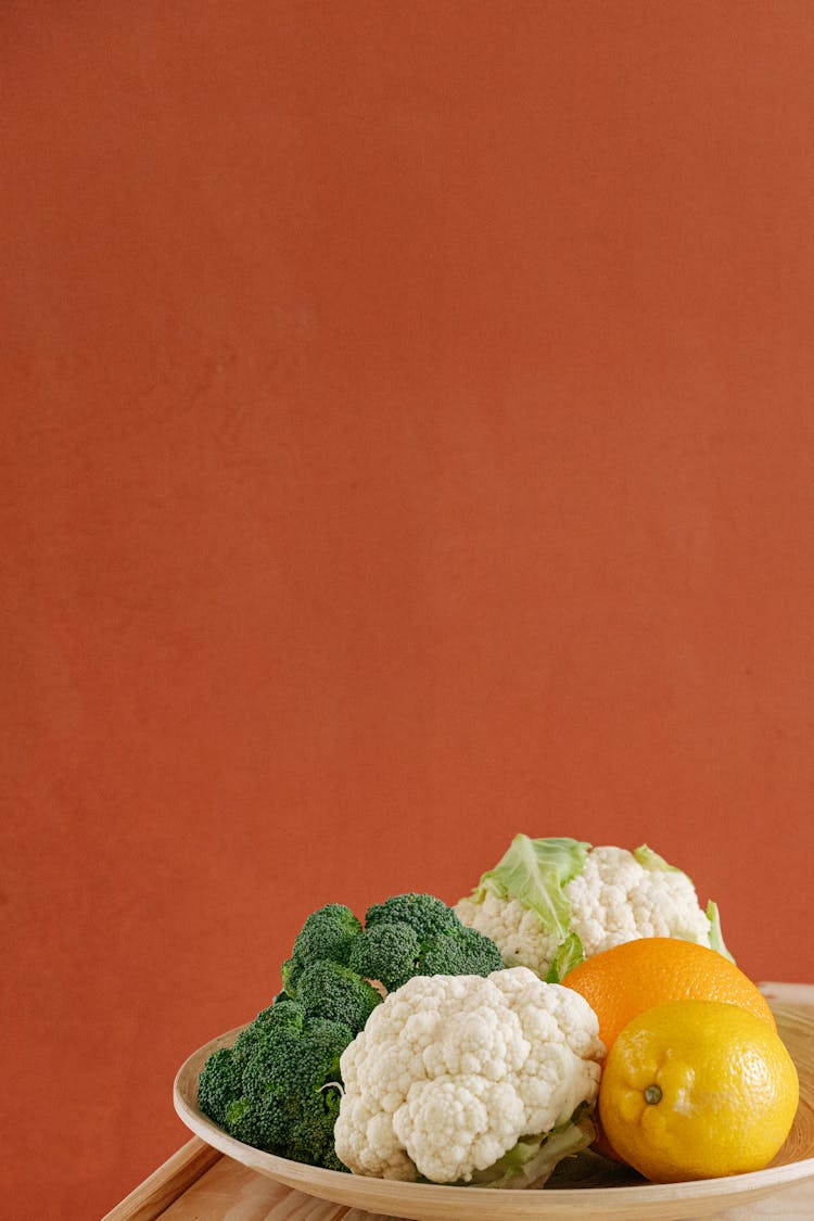 Fruits And Vegetables On Ceramic Plate