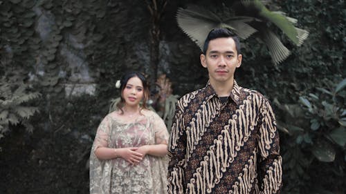 A Couple in Traditional Wedding Clothes