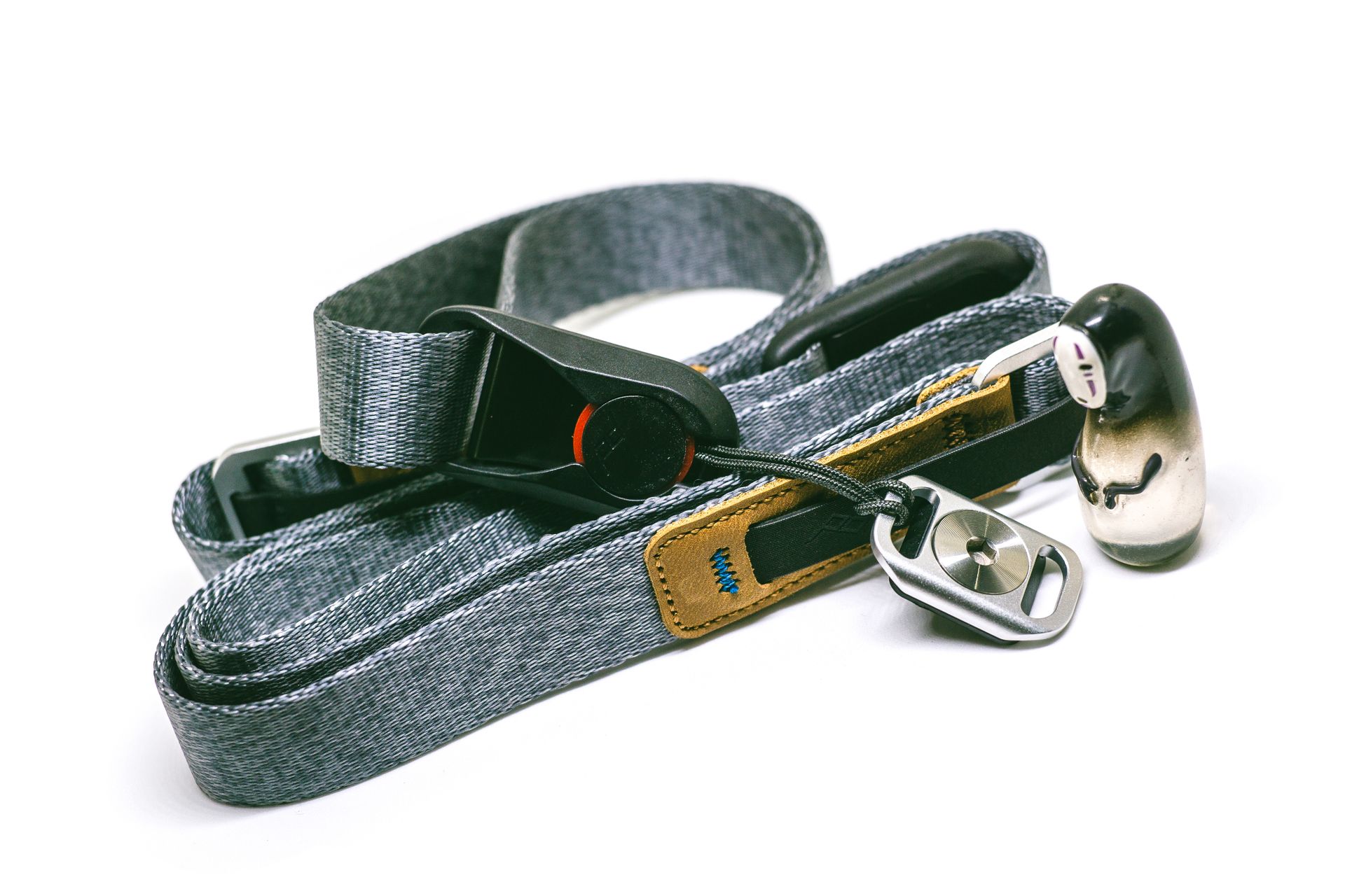 High-quality denim camera strap with durable metal clips and stylish design for photography enthusiasts.