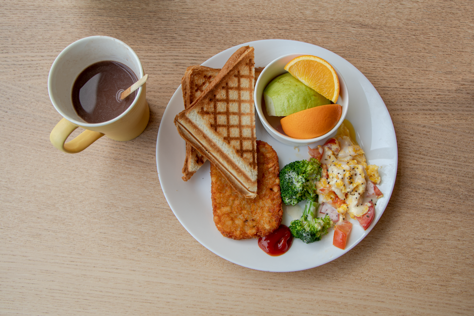 Delicious breakfast featuring toast, fruits, and coffee, perfect for a healthy start.
