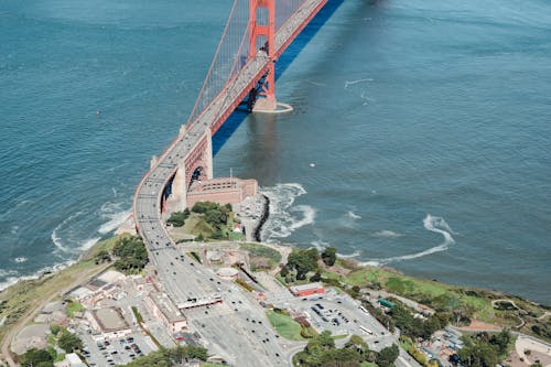 Free Contemporary suspension bridge above blue bay Stock Photo