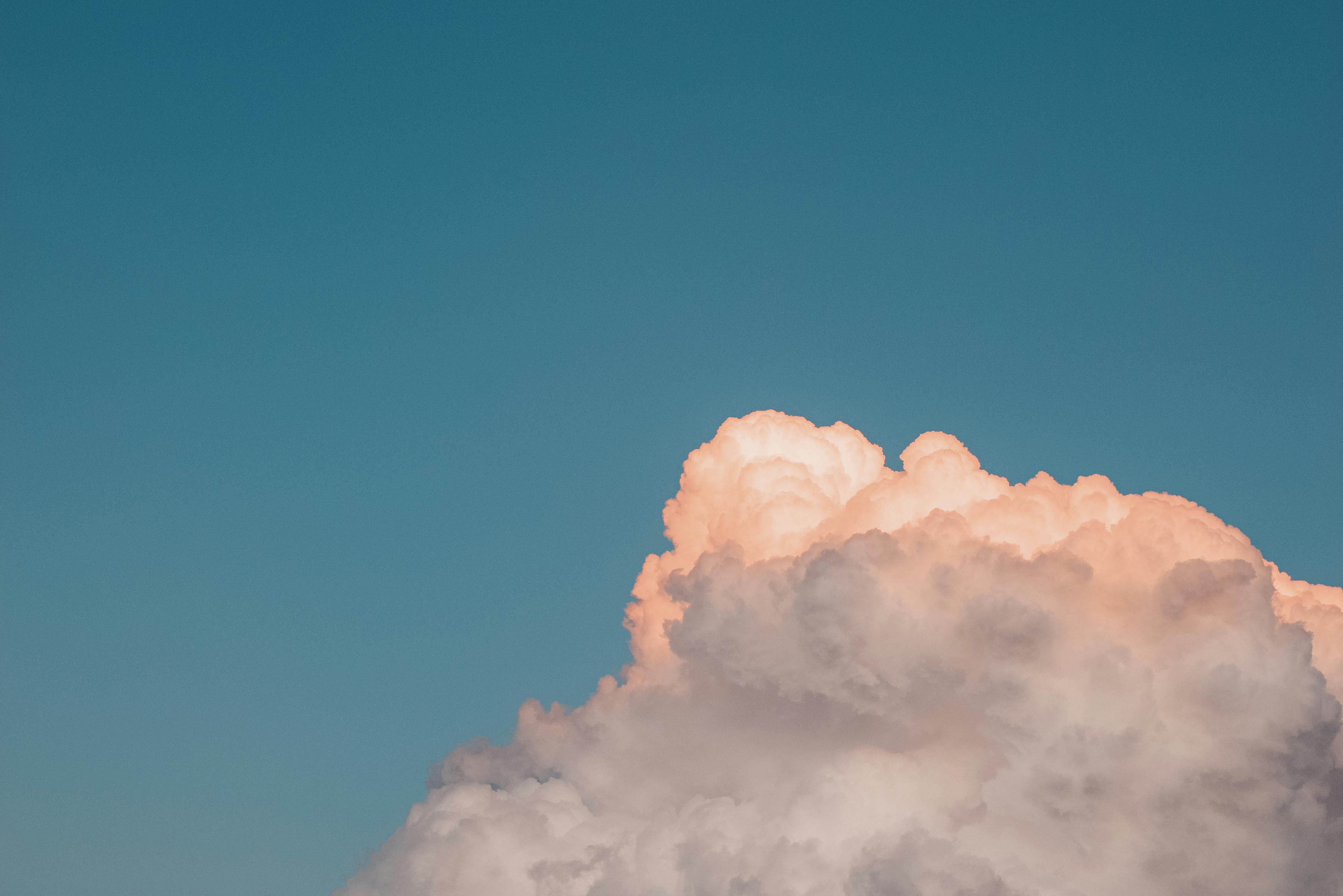 Fluffy pink cloud in sunset sky · Free Stock Photo