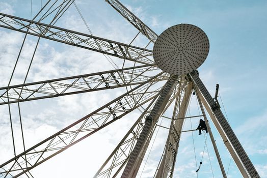 Person on amusement ride under clear sky
