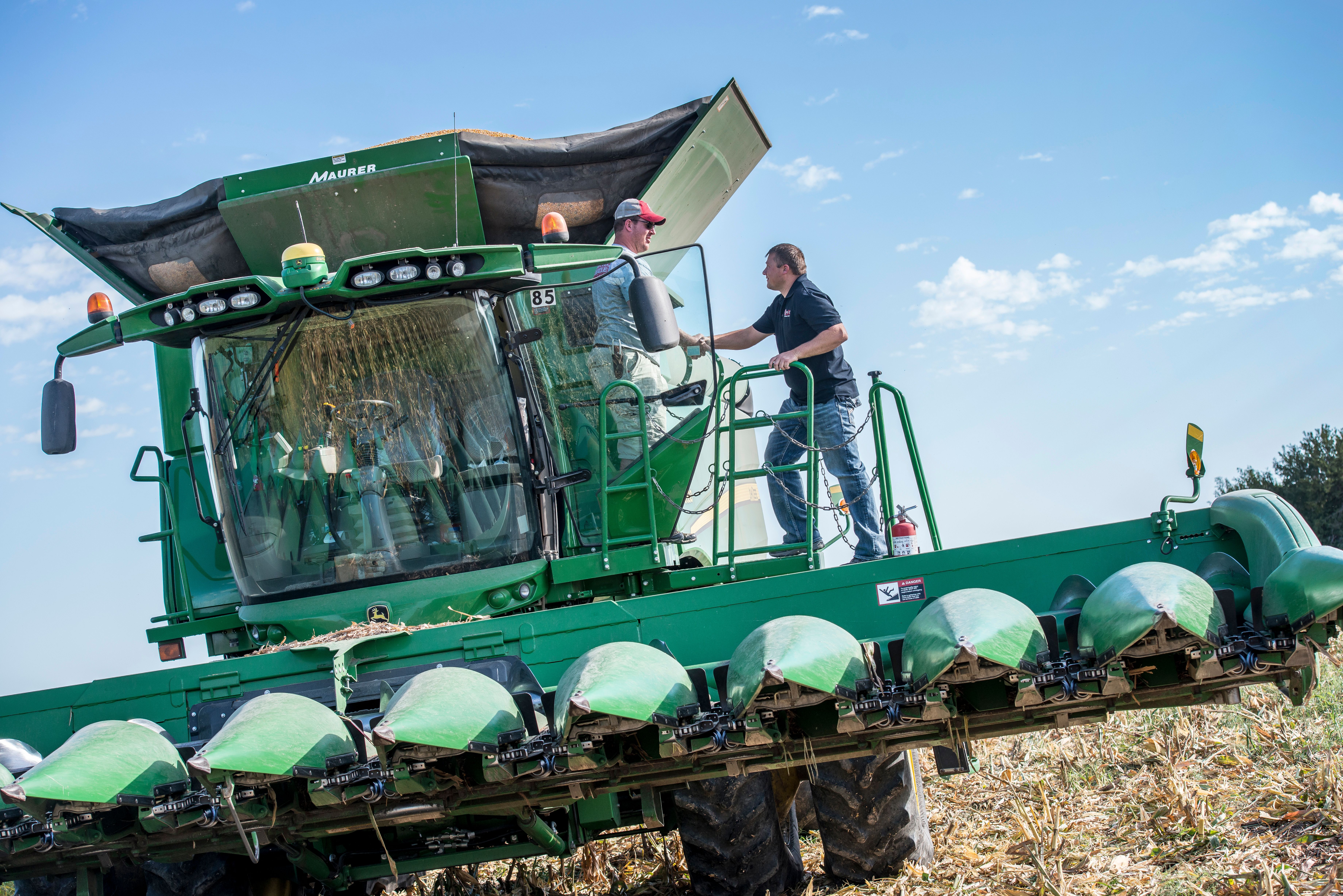Free stock photo of combine tractor farmer handshake