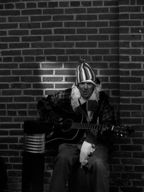 A Man Playing an Acoustic Guitar