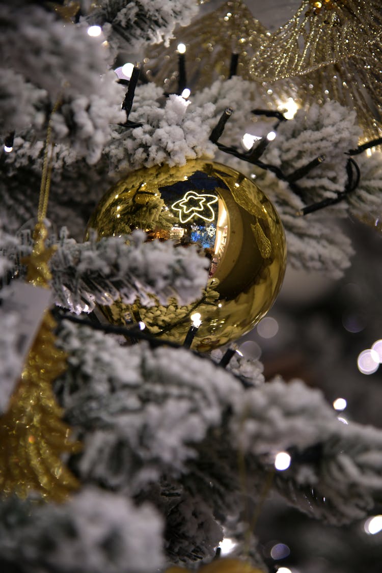 Gold Bauble On A Christmas Tree