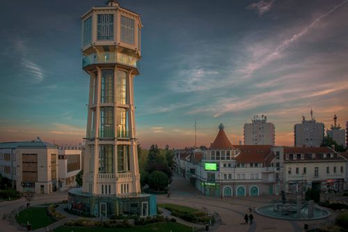 Free Picturesque Siófok view featuring iconic water tower during twilight, showcasing beautiful architecture and serene skyline. Stock Photo