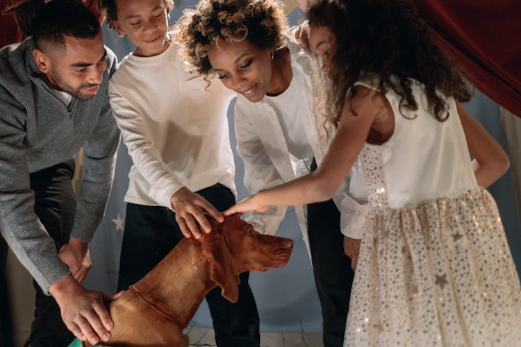 Family Petting Their Dog