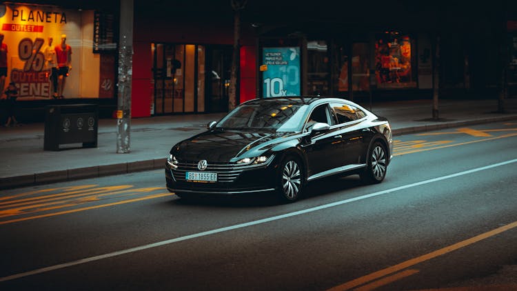 Black Sedan On Asphalt Road 