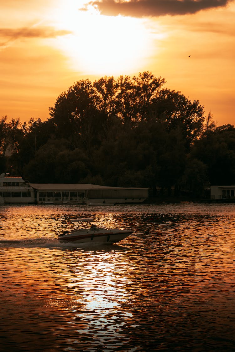 Speedboat On The Lake During Sunset