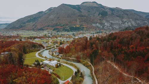 Rural town in mountainous terrain with river