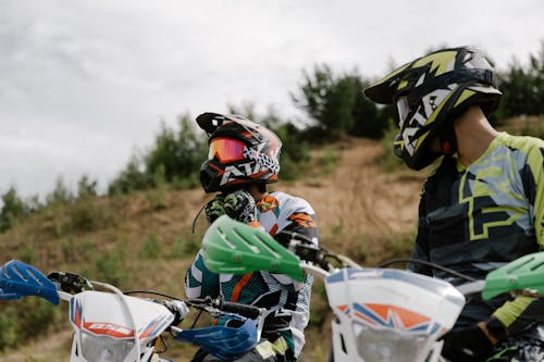 Men Wearing Motocross Helmets