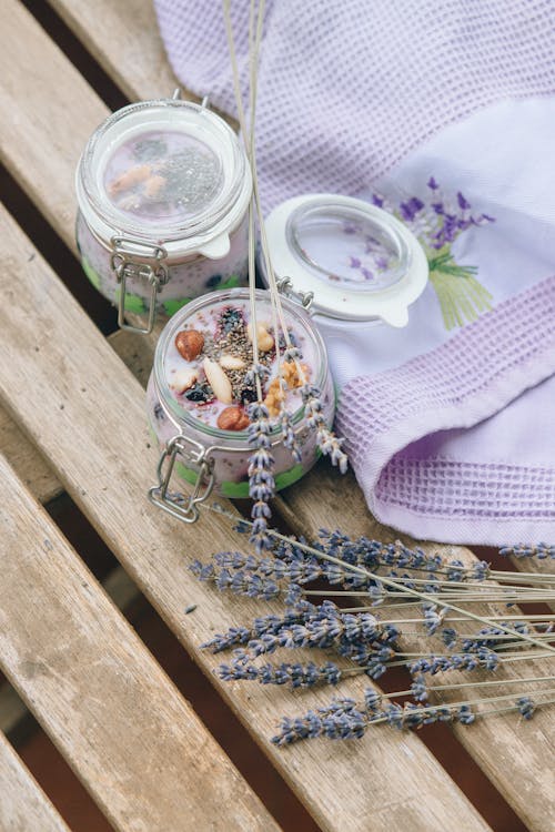 A Jar of Delicious Dessert Beside Lavender Flowers
