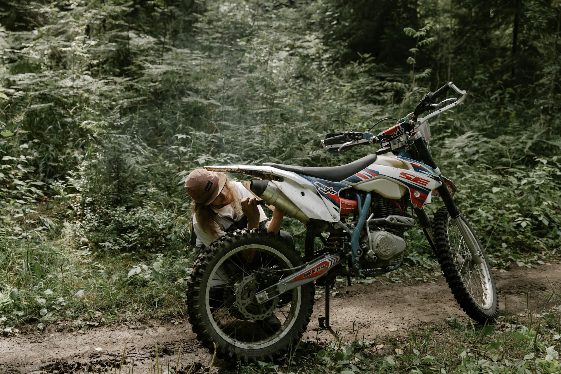 Man Repairing a Motorcycle