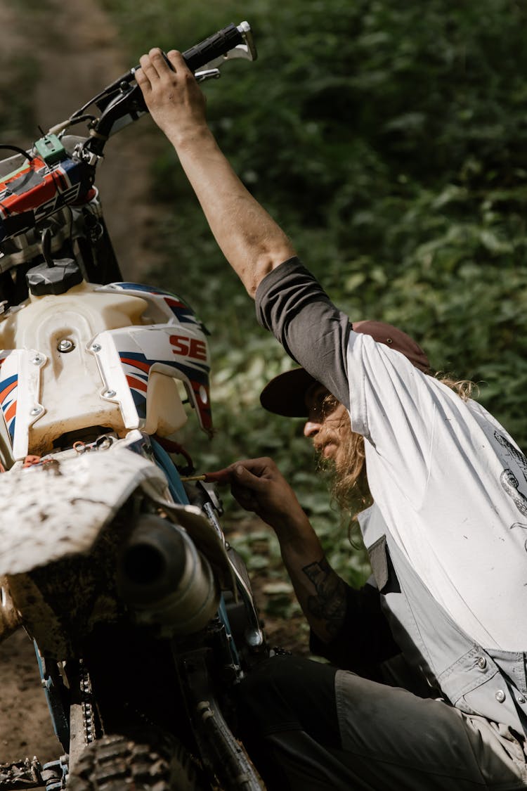 Mechanic Repairing A Motorcycle