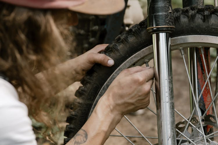 Person Holding Black Motorbike Tire