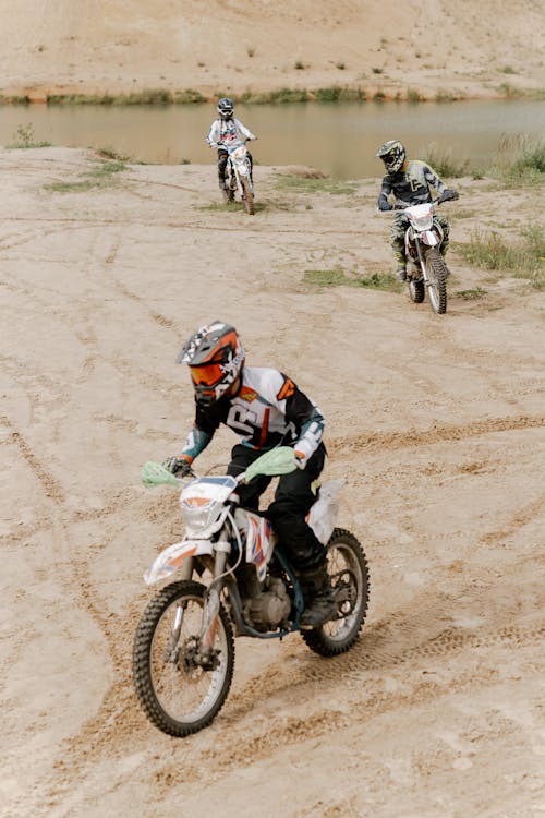 People Riding on Motocross Dirt Bikes