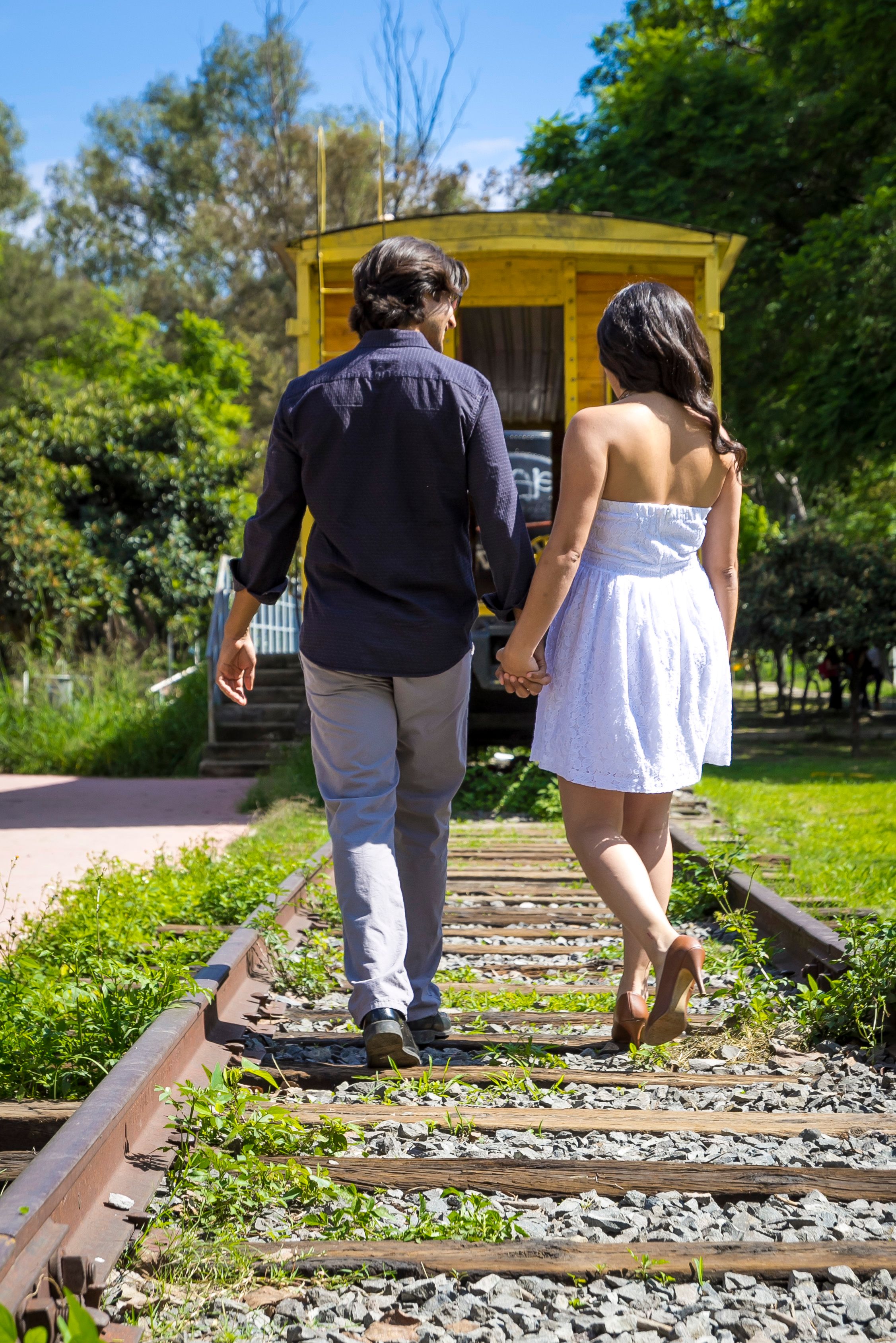 A Couple Walking on a Train Railway · Free Stock Photo