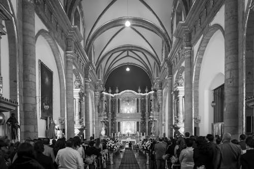 Free People Inside a Cathedral in Grayscale Photography Stock Photo