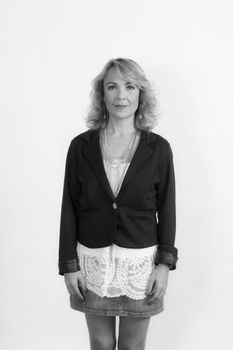Monochrome portrait of a middle-aged woman looking confidently at the camera.