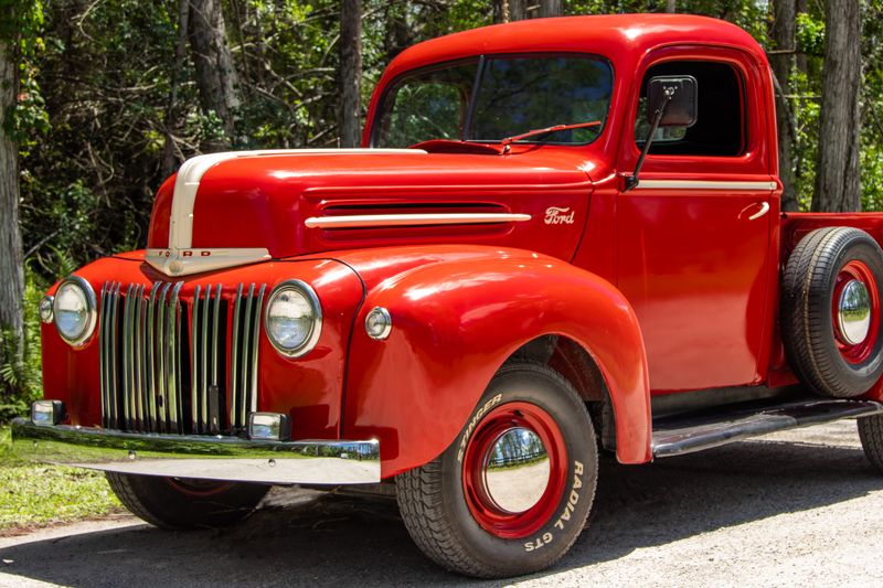 Classic red Ford truck from the 1940s in nature