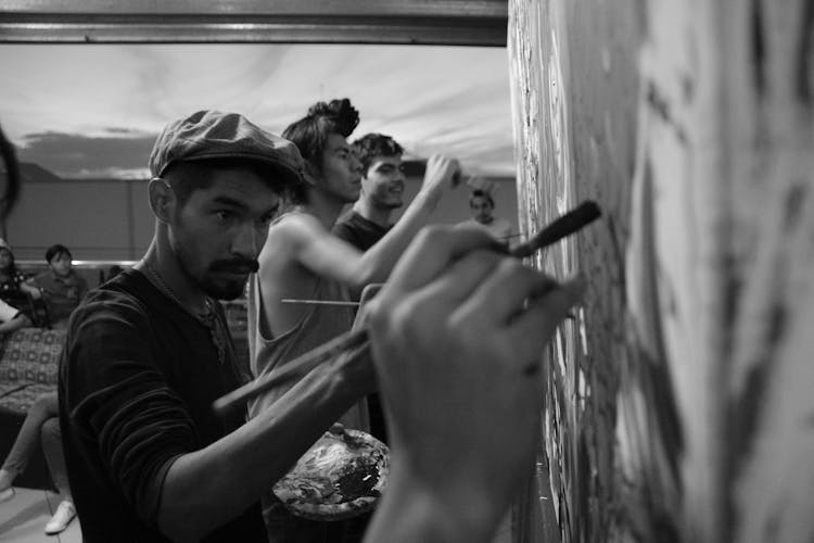 Grayscale Photo Of Painters Working Together