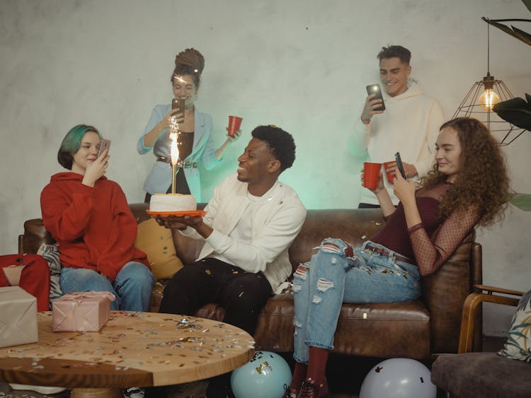 A Man Holding His Birthday Cake