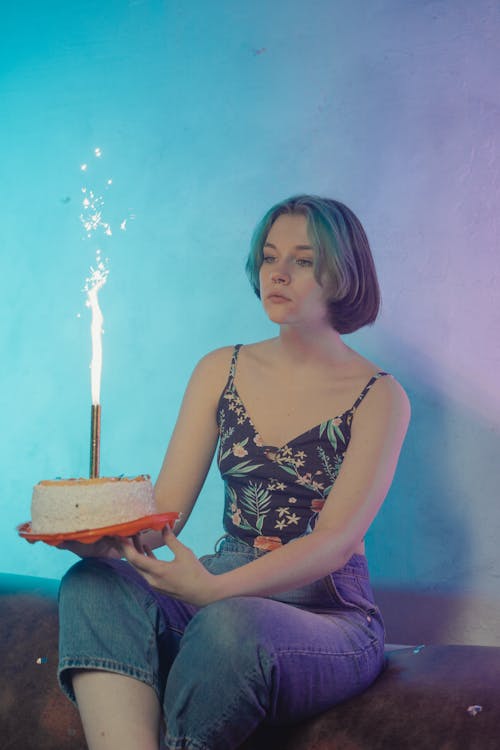 A Woman Holding a Cake