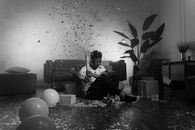 A Man Sitting on the Floor