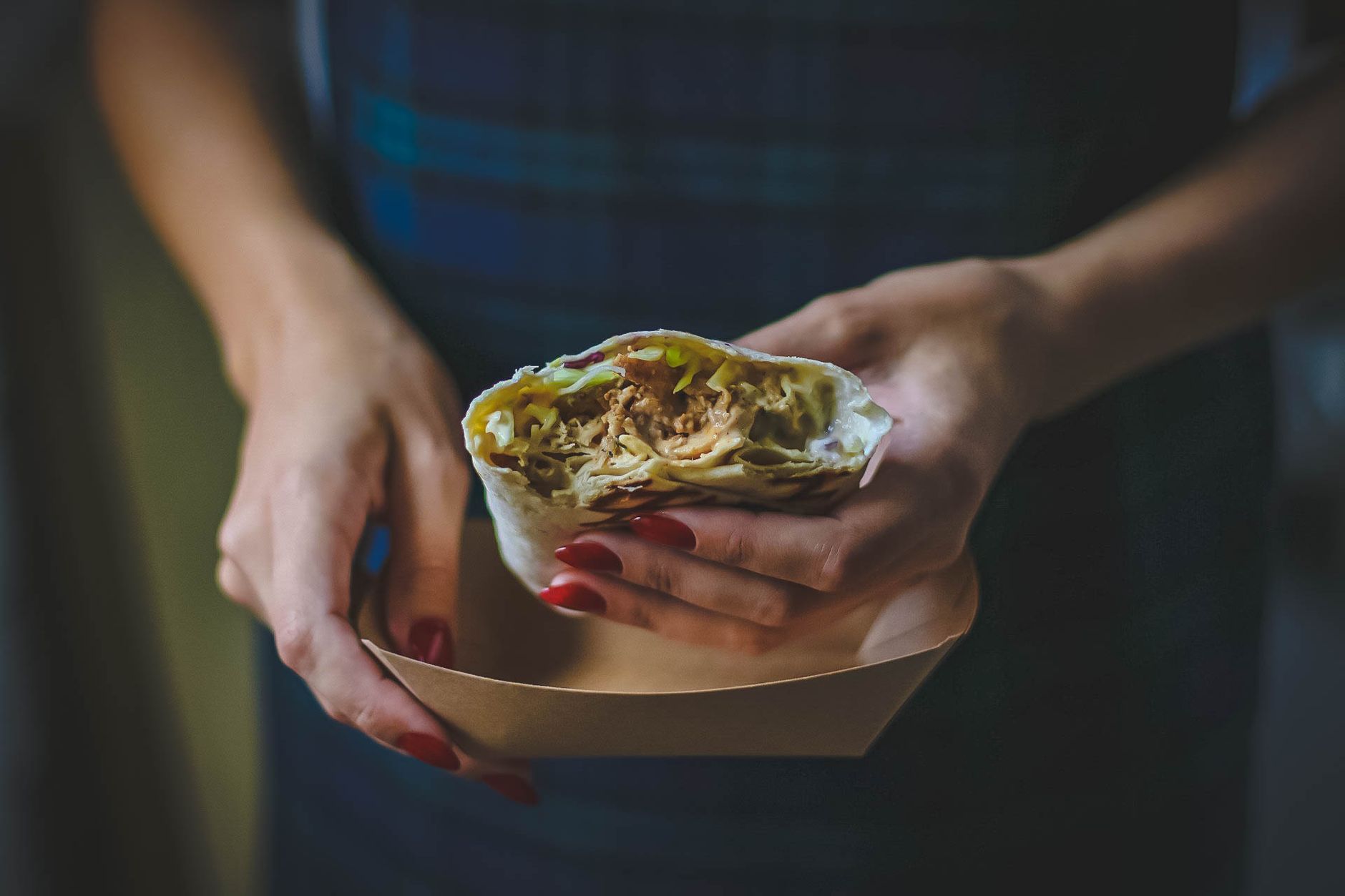 A fresh chicken wrap with crisp veggies and creamy sauce