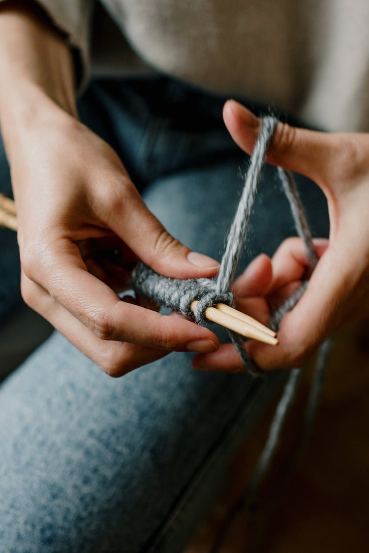 Close-up Of Hands Of Woman Crocheting